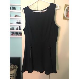 Black romper with gold zippers